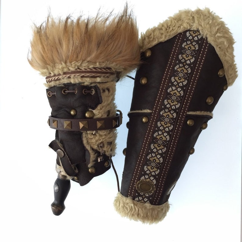 Barbarian Master 3-Piece Set – Perfect for Fighter, Warlock, and Assassin characters in LARP, Cosplay, and Ren Faire events. Includes: Faux Fur & Leather Waistcoat, Ornate Hood, and Faux Fur Vambraces with foam Throwing Dagger.