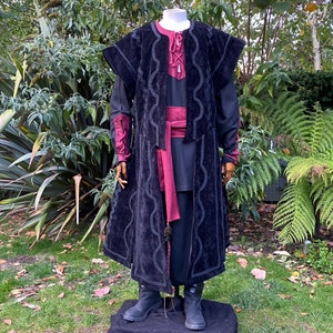 Dark King LARP costume set for nobles, elves & alchemists. Includes black suede waistcoat, layered faux leather hood, wool tunic, hero/ Viking pants, buffalo leather belt, arm wraps & wool sash. Ideal for Ren Faire, cosplay & medieval fantasy events.
