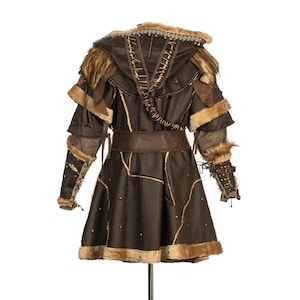 Barbarian Master 3-Piece Set – Perfect for Fighter, Warlock, and Assassin characters in LARP, Cosplay, and Ren Faire events. Includes: Faux Fur & Leather Waistcoat, Ornate Hood, and Faux Fur Vambraces with foam Throwing Dagger.