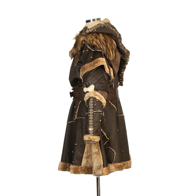 Barbarian Master 3-Piece Set – Perfect for Fighter, Warlock, and Assassin characters in LARP, Cosplay, and Ren Faire events. Includes: Faux Fur & Leather Waistcoat, Ornate Hood, and Faux Fur Vambraces with foam Throwing Dagger.