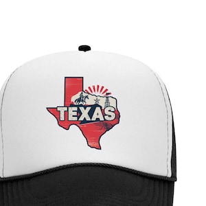 May include: A white and black trucker hat with a red and blue outline of the state of Texas with the word "TEXAS" in blue letters. The hat has a black mesh back.