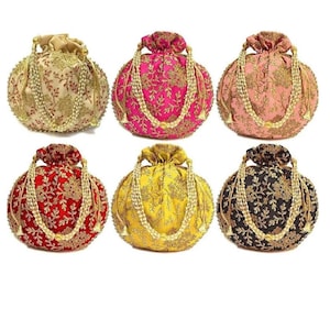 May include: Six embroidered drawstring bags in various colours, including gold, pink, red, yellow, and black. Each bag has a gold beaded drawstring and a tassel.