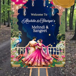 May include: A welcome sign for a Mehndi & Sangeet celebration featuring a couple dancing in traditional Indian attire. The sign is decorated with a peacock, floral accents, and a blue and gold archway. The text on the sign reads "Welcome To Akshita & Sharya's Mehndi & Sangeet".