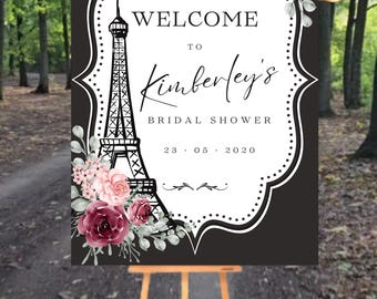 May include: A black and white printable sign with a floral design and a graphic of the Eiffel Tower. The sign says "Welcome to Kimberley's Bridal Shower 23.05.2020".