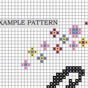 May include: A cross-stitch pattern grid with the text "EXAMPLE PATTERN". The pattern features various colored blocks, including pink, yellow, and blue, with numbers and symbols. A black and white design is at the bottom.