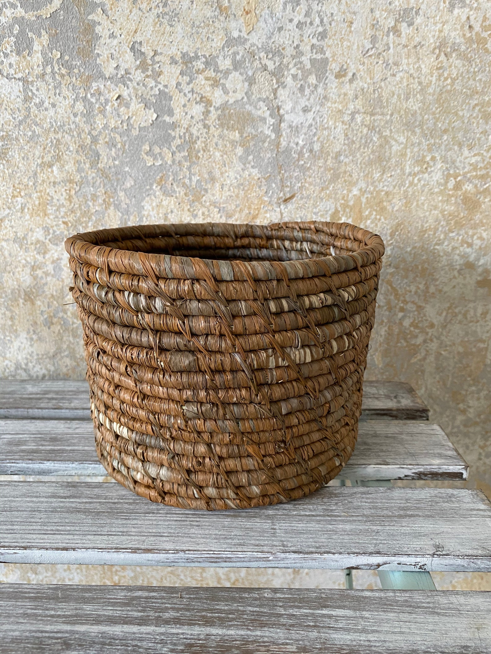 This beautiful raffia basket is unique in brown. He is Etsy