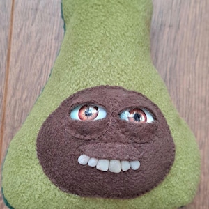 Cute but creepy avocado cuddler