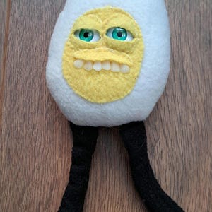 Cute but creepy boiled egg cuddler