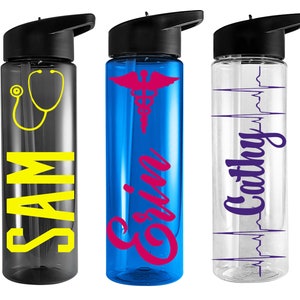 May include: Three personalized water bottles with different designs. The first bottle is black with a yellow stethoscope and the name "SAM" in yellow. The second bottle is blue with a pink caduceus and the name "Erin" in pink. The third bottle is clear with a purple EKG and the name "Cathy" in purple.