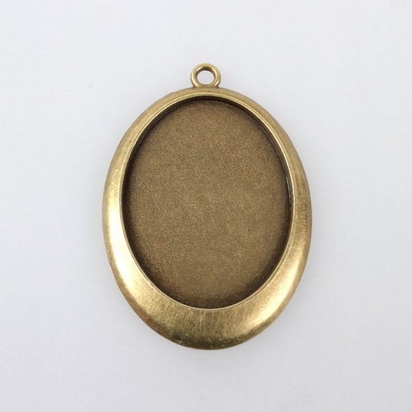 un support ovale bronze médaillon  pour cabochons de 40 x 30 mm