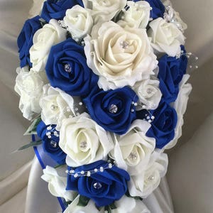 Royal Blue & Ivory wedding bouquets with butterflies, Brides, Bridesmaids, Flowergirls etc Brides Teardrop