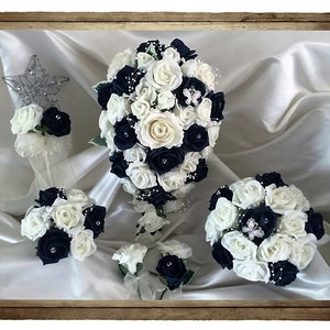 Wedding Flowers Navy Blue & Ivory wedding bouquets with butterflies, Brides, Bridesmaids, Flowergirls etc