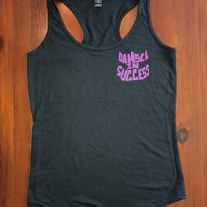 May include: A black tank top with a purple graphic that says "Damsel in Success".