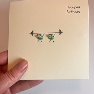 Carte d'haltérophilie aux paires de petits pois.