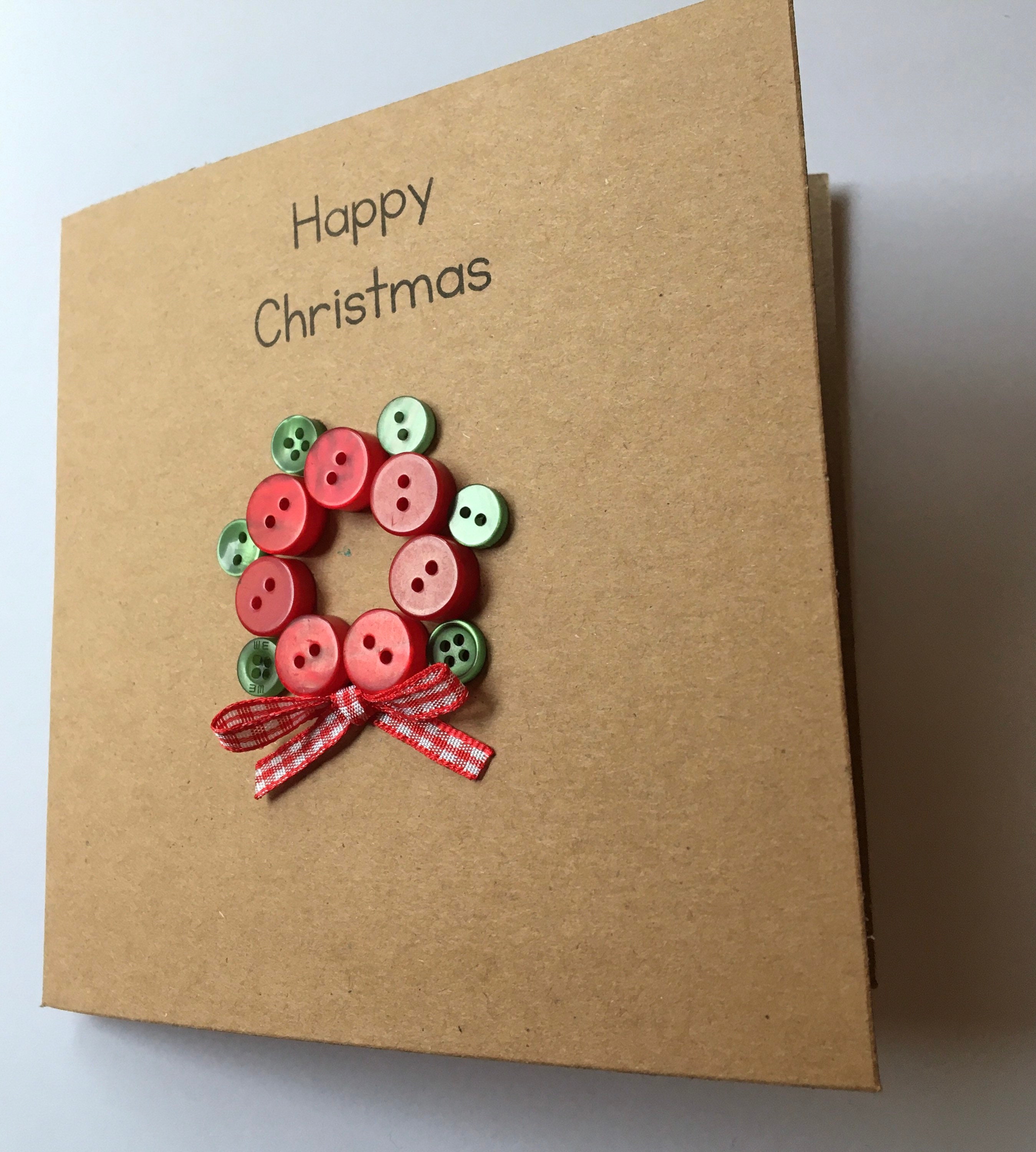 Individual Christmas cards handmade with buttons and ribbon.  Etsy