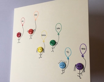 Birthday card with "happy birthday" balloons held by my rainbow button little people. Hand made. On brown or cream card