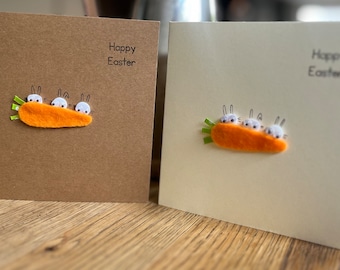 My Easter bunnies hiding behind a carrot! On kraft brown or cream  card. Easter greeting cards . Sold individually.