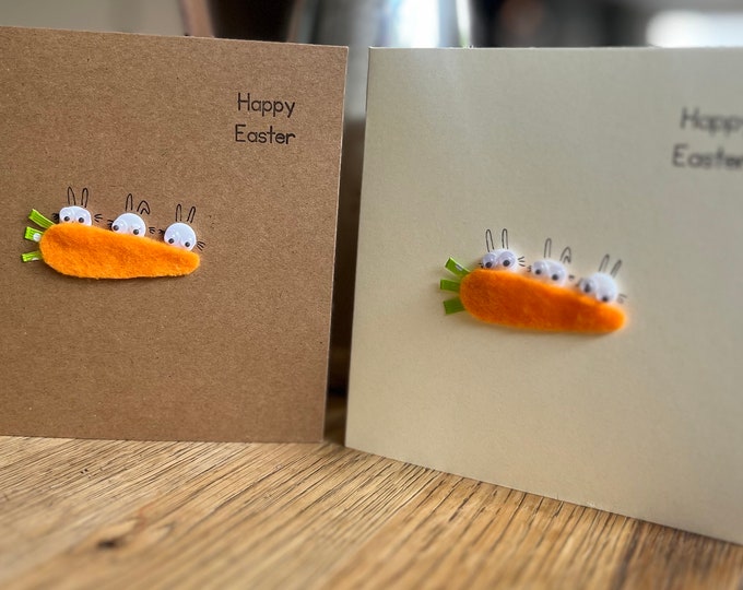 My Easter bunnies hiding behind a carrot! On kraft brown or cream  card. Easter greeting cards . Sold individually.