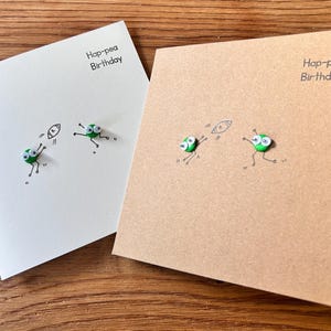 Rugby spielende Paar Erbsen-Karte. Glückwünsche zum Geburtstag.