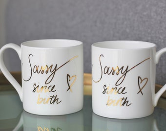 Set of two Sassy Since Birth fine bone china mugs printed in gold, funny coffee cup, designed and manufactured in the UK