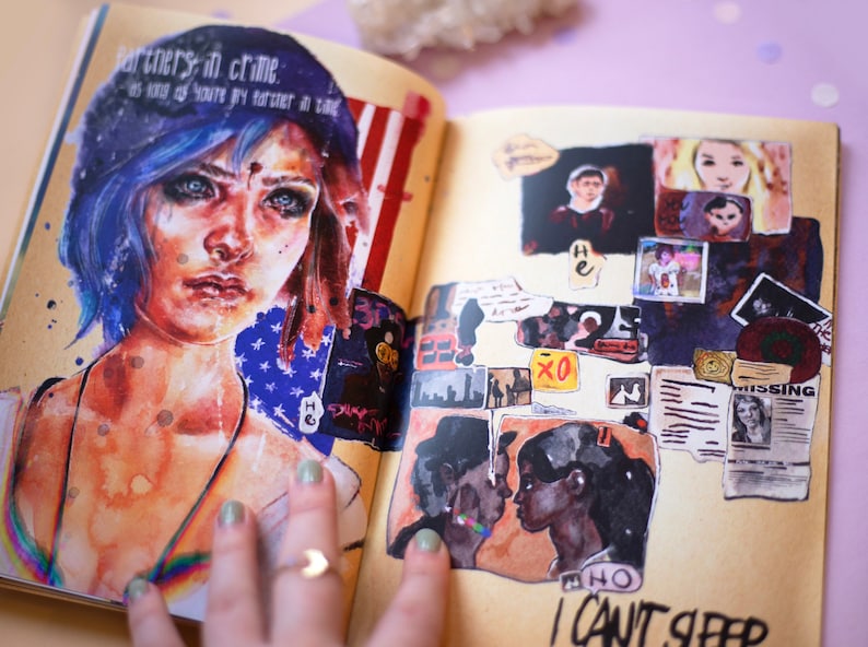 May include: Open journal with watercolor illustrations and collaged images. The left page features a portrait of a person with blue hair and the text "Partners in Crime." The right page has various collaged images and the text "I Can't Sleep."