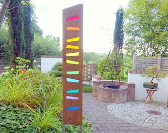 Garden sculpture made of wood and glass. A unique, handmade, and weatherproof garden decoration.