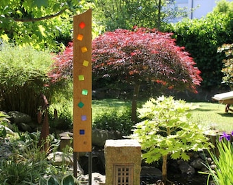 Garden sculpture made of wood and glass. Garden decorations are unique, handmade and weatherproof.