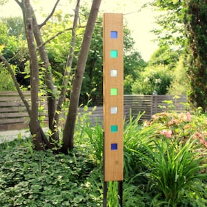 Garden sculpture made of wood and glass. Garden decoration as unique pieces, handmade and weatherproof.