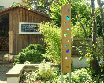Garden sculpture made of wood and glass. Garden decorations are unique, handmade and weatherproof.