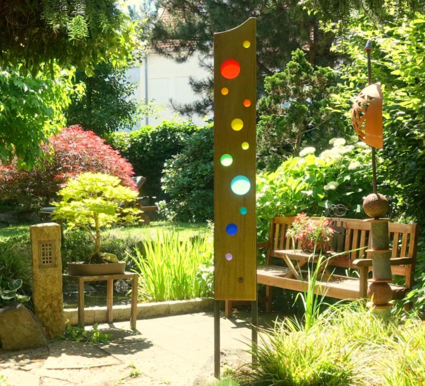 Garden sculpture made of wood and glass. Garden decoration as unique pieces, handmade and weatherproof.