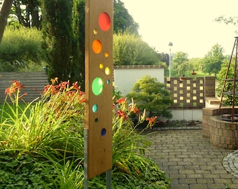 Garden sculpture made of wood and glass. Garden decoration as unique pieces, handmade and weatherproof.