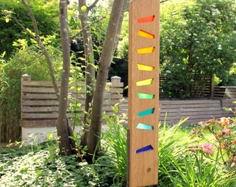 Garden sculpture made of wood and glass. A unique, handmade, and weatherproof garden decoration.