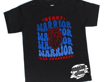 May include: Black t-shirt with a blue and red graphic that says "Heart Warrior" with a heart graphic in the center. The text "CHD Awareness" is printed below the graphic. The shirt has a small logo on the bottom right corner that says "Maglio by design".