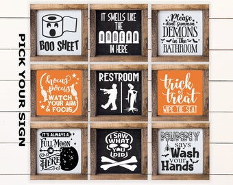 May include: Nine Halloween-themed wooden signs with various phrases and graphics. The signs include phrases like "Boo Sheet," "Trick or Treat," and "Wash Your Hands." Each sign is square and framed in rustic wood.