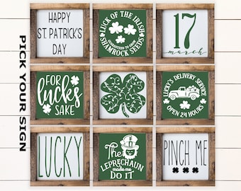 May include: Nine square wooden signs with St. Patrick's Day themes. Each sign has a white background with green text and images, including shamrocks, the date March 17, and phrases like "Happy St. Patrick's Day" and "Pinch Me."