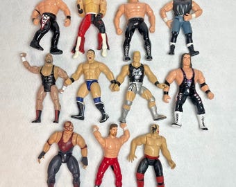 Lot of 11 WWE WWF WCW Wrestling Figures Jakks & ToyBiz Rock Austin Kane Hogan