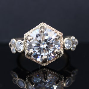 9ct Yellow gold engagement ring that features 8 diamonds surrounding a 10.1mm (4carat) Lab Diamond. Unique ring. Beautiful ring. Handmade
