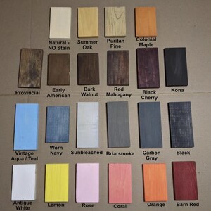 May include: A chart displaying 20 different wood stain colours, including natural, summer oak, puritan pine, colonial maple, provincial, early american, dark walnut, red mahogany, black cherry, kona, vintage aqua teal, worn navy, sunbleached, briarsmoke, carbon grey, black, antique white, lemon, rose, coral, orange, and barn red.