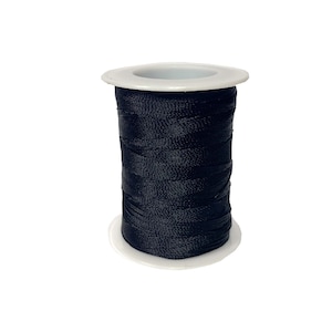 May include: A spool of black thread wound around a white plastic bobbin.