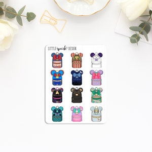 May include: A sheet of 12 colorful Disney-themed backpack stickers with Mickey Mouse ears. The stickers feature various colors and patterns, including red, blue, green, purple, and pink.