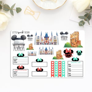 May include: A sheet of Disney-themed planner stickers featuring illustrations of park landmarks, Mickey Mouse silhouettes, and Minnie Mouse bows. Includes boxes for dining reservations and ride times, and the text "Hollywood Studios".