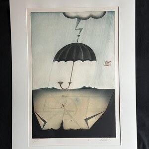 May include: An artistic print featuring a black umbrella under a stormy sky with a lightning bolt. The umbrella is positioned above a map with a compass rose and the letter "N". The print is framed in a white mat.