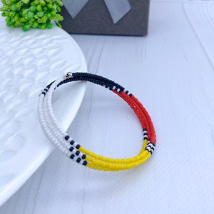 Beaded bracelet in Native Medicine Wheel style Memory wire seed bead bracelet American Traditional jewelry Red black yellow white
