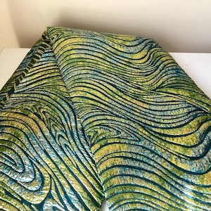 Metallic jacquard brocade with floral embossing and lustrous sheen in multi-tone blossom motif