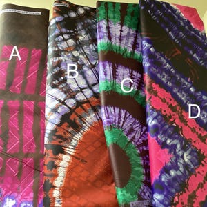 May include: Four different fabric swatches with tie-dye patterns in shades of pink, purple, green, and blue. The fabric swatches are labeled A, B, C, and D.