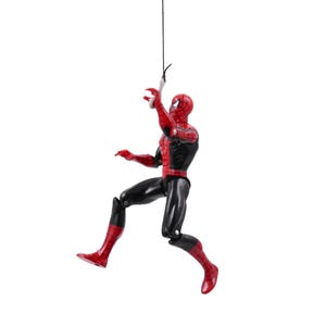 May include: A Spider-Man action figure in a dynamic pose, suspended from a black string. The figure is predominantly red and black, with a detailed mask and suit. The figure is approximately 6 inches tall.