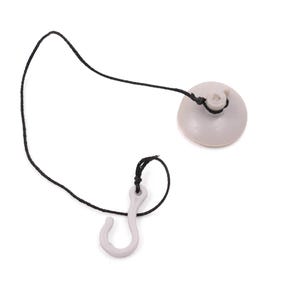 May include: A light gray suction cup with a black cord and a matching hook. The suction cup is round and has a small hole in the center. The hook is curved and has a small loop at the top. The cord connects the two pieces.
