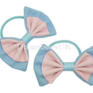 Adorable Baby Blue and Baby Pink Fabric Hair Bows on Thin bobbles for Her Delightful Look!