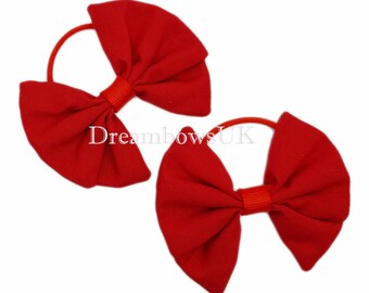 Elevate Her Style with Classic Red Fabric Hair Bows on Thin bobbles!