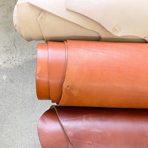 Full Grain Veg Tanned Leather Hide. 19-26 sq ft. Sold by the SIDE. Full Grain Vegetable Tanned Cowhide. 8-10oz Tooling Leather. Ships Fast!
